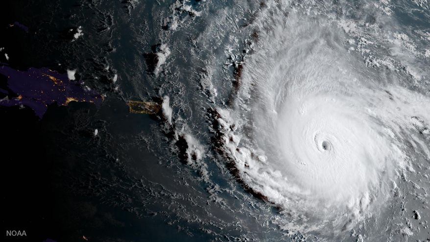 In this geocolor image captured by GOES-16 and released by the National Oceanic and Atmospheric Administration (NOAA), Hurricane Irma, a potentially catastrophic category 5 hurricane, moves westward, Tuesday morning, Sept. 5, 2017, in the Atlantic Ocean toward the Leeward Islands. This image was captured as daylight moves into the area, right, with nighttime features on the left side of the image. Hurricane Irma grew into a dangerous Category 5 storm, the most powerful seen in the Atlantic in over a decade, and roared toward islands in the northeast Caribbean Tuesday on a path that could eventually take it to the United States. (NOAA via AP)