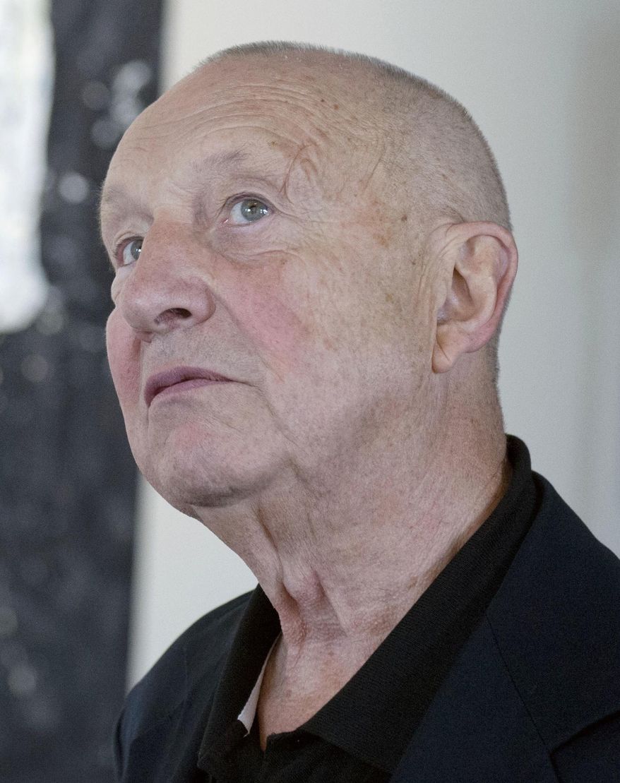 FILE - In this Sept. 20, 2013 file photo German painter Georg Baselitz waits during the press preview of the exhibition 'Georg Baselitz. Background Stories' by the Galerie Neue Meister (New Masters Gallery) in Dresden, Germany. Authorities in Germany say they've recovered 15 stolen paintings and drawings by German artist Georg Baselitz worth 2.5 million euros ($2.9 million). Munich prosecutors said in a statement Tuesday Sept. 5, 2017, that a 51-year-old man accused of selling the art was arrested last month after returning from a trip abroad. (AP Photo/Jens Meyer)