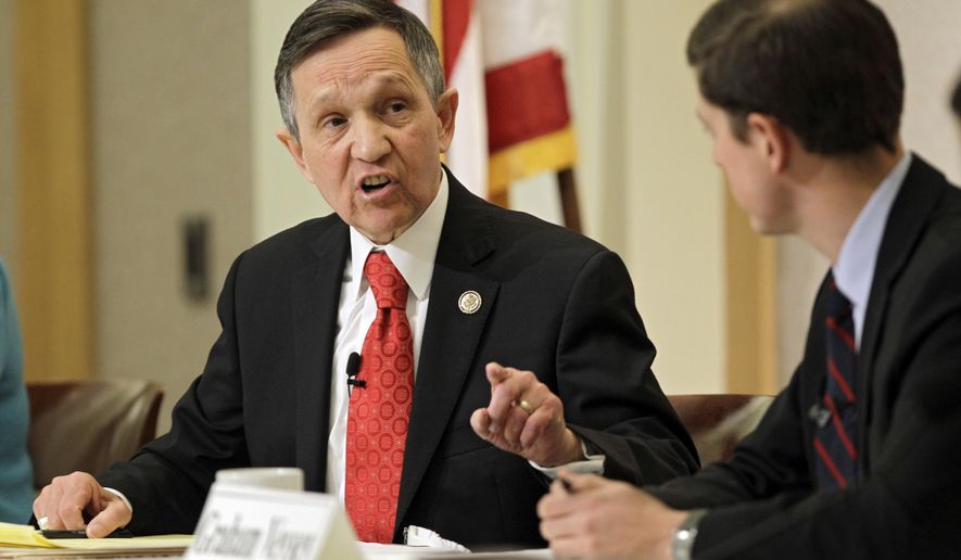 FILE - In this Feb. 20, 2012, file photo, U.S. Rep. Dennis Kucinich disputes an point from businessman Graham Veysey during a debate at the City Club in Cleveland. Kucinich, an ex-Ohio congressman, says he found his county&#x27;s elections board offices unlocked and unoccupied when he tried to cast an early ballot. He says he made the discovery Saturday, Sept. 2, 2017, when he walked inside the Cuyahoga County Board of Elections to cast a vote ahead of Cleveland’s Sept. 12 primary. (AP Photo/Mark Duncan, File)