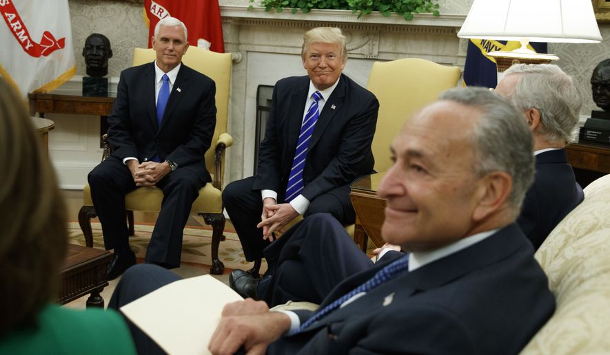 Vice President Mike Pence looks on with President Donald Trump during a meeting with Senate Minority Leader Chuck Schumer, D-N.Y., and other Congressional leaders in the Oval Office of the White House, Wednesday, Sept. 6, 2017, in Washington. (AP Photo/Evan Vucci)