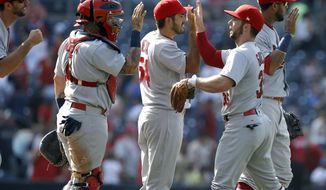 St. Louis Cardinals congratulate each other after their team defeated the San Diego Padres 2-0 in a baseball game in San Diego, Monday, Sept. 4, 2017. (AP Photo/Alex Gallardo)