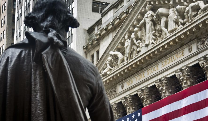 FILE - In this Wednesday, July 8, 2015, file photo, Federal Hall's George Washington statue stands near the flag-covered pillars of the New York Stock Exchange. U.S. stocks edged higher in early trading Wednesday, Sept. 6, 2017, recouping some of the market’s losses from a day earlier. Banks and energy companies were driving the gains. Airlines, cruise ship operators and travel booking companies were down amid concerns that Hurricane Irma could strike the United States later this week. (AP Photo/Bebeto Matthews, File)