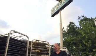 In this Sept. 2, 2017 photo, Bobby Jucker, owner of Three Brothers Bakery, cleans up storm damage at his bakery in Houston. In 2008, Hurricane Ike tore the roof off his business. Now he estimates he&#39;s facing $1 million in damage and lost revenue from Hurricane Harvey, the fifth time a storm has put his bakery out commission. (AP Photo/Brian Melley)