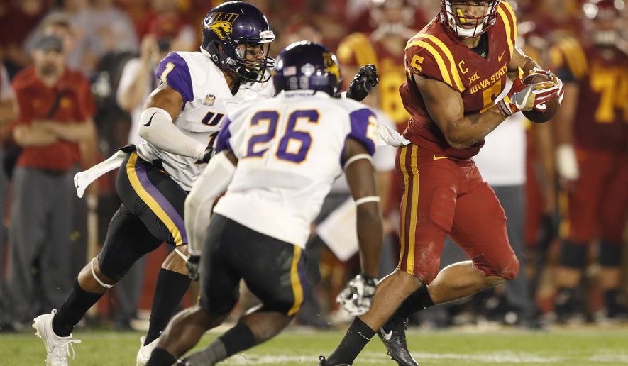 FILE - In this Sept. 2, 2017, file photo, Iowa State wide receiver Allen Lazard, right, runs from Northern Iowa's Elijah Campbell, left, and Isaiah Nimmers (26) after making a reception during the second half of an NCAA college football game, in Ames, Iowa. This year's Iowa-Iowa State game might feature as much in-state talent as any matchup in recent memory. (AP Photo/Charlie Neibergall, File)