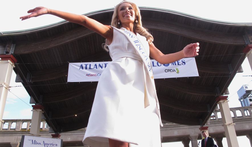 This Aug. 30, 2017, photo shows Miss Wisconsin McKenna Collins greeting the public during a welcome ceremony in Atlantic City N.J. The 97th Miss America competition begins Wednesday, Sept. 6, with the first of three days of preliminary competition. (AP Photo/Wayne Parry)