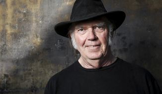 FILE - In this May 18, 2016 file photo, Neil Young poses for a portrait in Calabasas, Calif. Young’s lost 1976 acoustic record ‘Hitchhiker’ uncovers previously unreleased tracks, versions of songs later to become standards. (Photo by Rich Fury/Invision/AP, File)