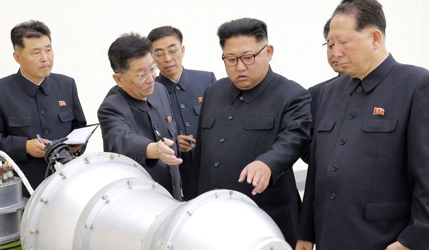 This undated file photo distributed on Sunday, Sept. 3, 2017, by the North Korean government, shows North Korean leader Kim Jong-un, second from right, at an undisclosed location. (Korean Central News Agency/Korea News Service via AP) ** FILE **