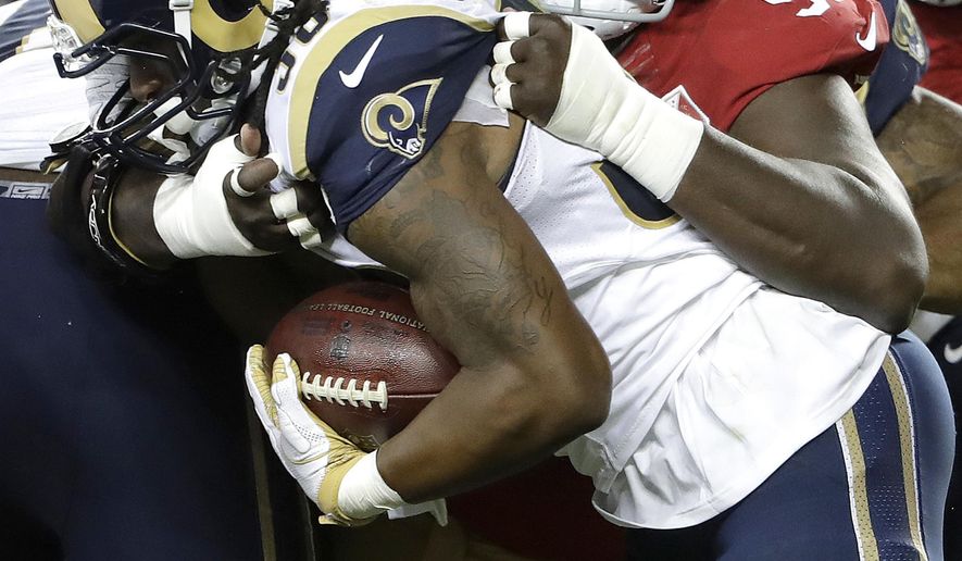 File- This Sept. 12, 2017, file photo shows San Francisco 49ers defensive end Quinton Dial (92) tackling Los Angeles Rams running back Todd Gurley during the first half of an NFL football game in Santa Clara, Calif. So many new veterans for the Green Bay Packers. At their core, the Packers still build through the draft. But general manager Ted Thompson has been more active than usual this season in signing veteran free agents. Dial, a 6-foot-5, 318-pound defensive lineman who signed on Tuesday, Sept. 5, 2017, after being released by the San Francisco 49ers. (AP Photo/Marcio Jose Sanchez, File)