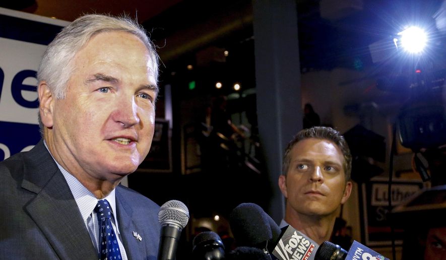 In this Aug. 15, 2017, file photo, Sen. Luther Strange speaks to media after forcing a runoff against former Chief Justice Roy Moore in Homewood, Ala. Strange on Tuesday, Aug. 29, launched his first salvo against Moore in the contentious Senate race, calling Moore a hypocrite “who has spent 40 years putting himself and his ambition ahead of Alabamians.” (AP Photo/Butch Dill, File)