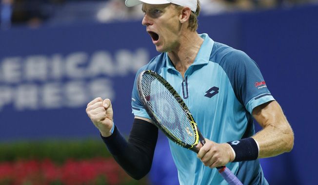 Kevin Anderson, of South Africa, reacts winning the third set in a quarterfinal against Sam Querrey, of the United States, at the U.S. Open tennis tournament in New York, early Wednesday, Sept. 6, 2017. (AP Photo/Kathy Willens)