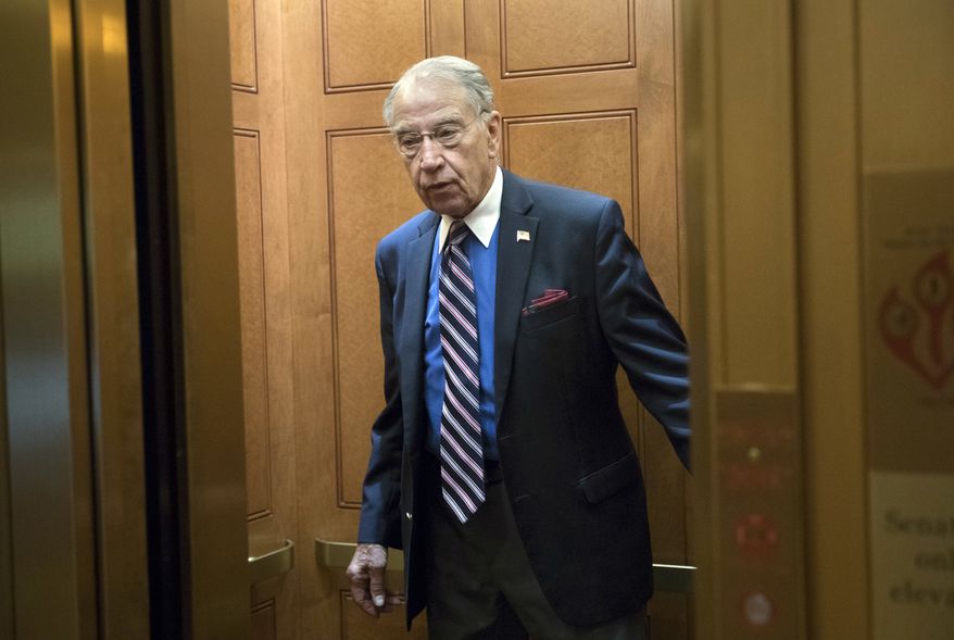 Senate Judiciary Committee Chairman Chuck Grassley, R-Iowa, arrives at the Capitol as his panel prepares to interview Donald Trump Jr., behind closed doors about the meddling and possible Russian links to President Donald Trump's 2016 presidential campaign, in Washington, Thursday, Sept. 7, 2017. Trump Jr. released a series of emails in July that detailed preparations for a June 2016 meeting with a Russian lawyer and others where he was expecting to get damaging information about Democratic candidate Hillary Clinton. (AP Photo/J. Scott Applewhite)