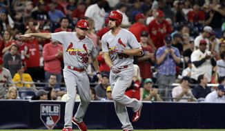 St. Louis Cardinals&#39; Stephen Piscotty, right, is greeted by St. Louis Cardinals third base coach Mike Shildt after hitting a two-run home run during the seventh inning of a baseball game against the San Diego Padres on Wednesday, Sept. 6, 2017, in San Diego. (AP Photo/Gregory Bull)