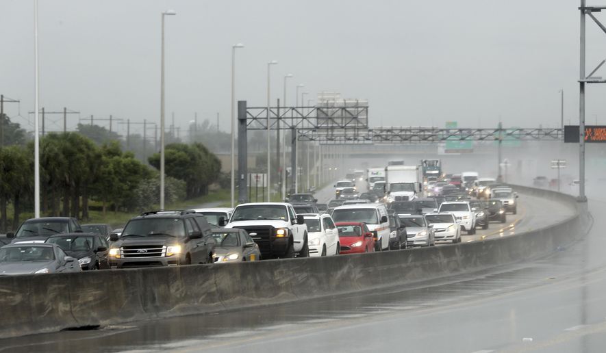 Northbound traffic on the turnpike near Sunrise Blvd. is backed up  in the rain as motorist prepare for Hurricane Irma on Thursday, Sept. 7, 2017 in Sunrise, Fla.  Irma cut a path of devastation across the northern Caribbean, leaving thousands homeless after destroying buildings and uprooting trees on a track Thursday that could lead to a catastrophic strike on Florida. (Mike Stocker/South Florida Sun-Sentinel via AP)