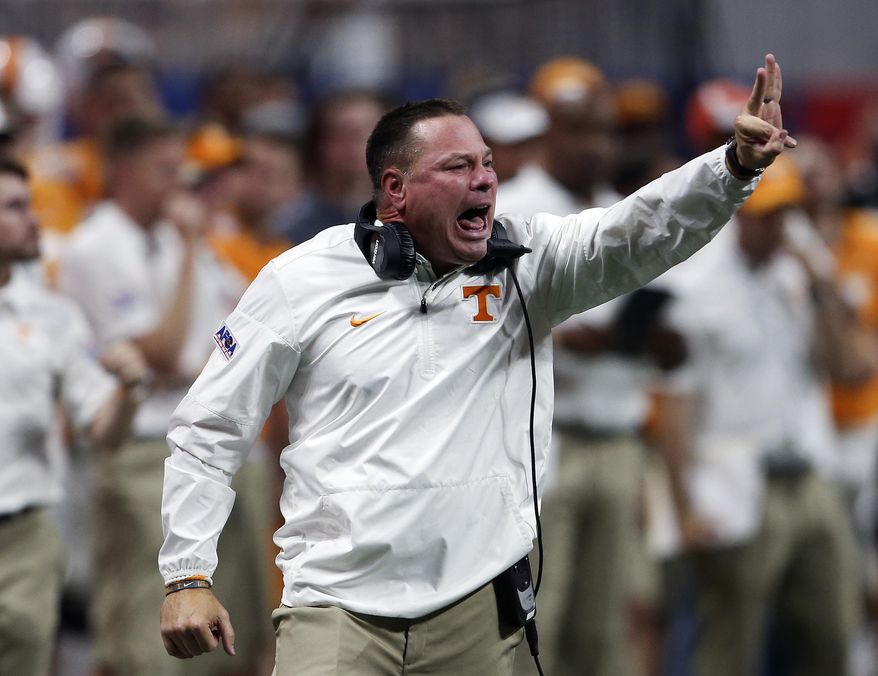Tennessee head coach Butch Jones signals to his players in the second half of an NCAA college football game against the Georgia Tech, Monday, Sept. 4, 2017, in Atlanta. (AP Photo/John Bazemore)