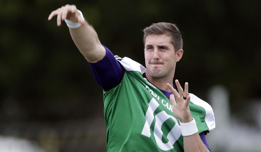 FILE - In this Aug. 4, 2017, file photo, East Carolina quarterback Thomas Sirk warms up during an NCAA college football practice in Greenville, N.C. Sirk will start at quarterback for East Carolina at West Virginia on Saturday after coming off the bench in a 34-14 loss to James Madison last week. (AP Photo/Gerry Broome, File)