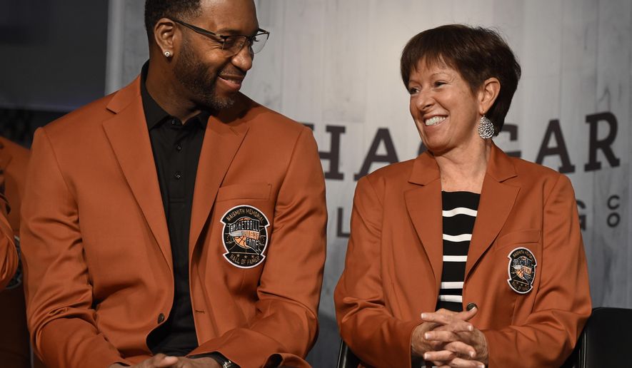 Inductees into the Basketball Hall of Fame Tracy McGrady, left, and Muffet McGraw, smile as they sit together during a news conference at the Naismith Memorial Basketball Hall of Fame, Thursday, Sept. 7, 2017, in Springfield, Mass. (AP Photo/Jessica Hill)