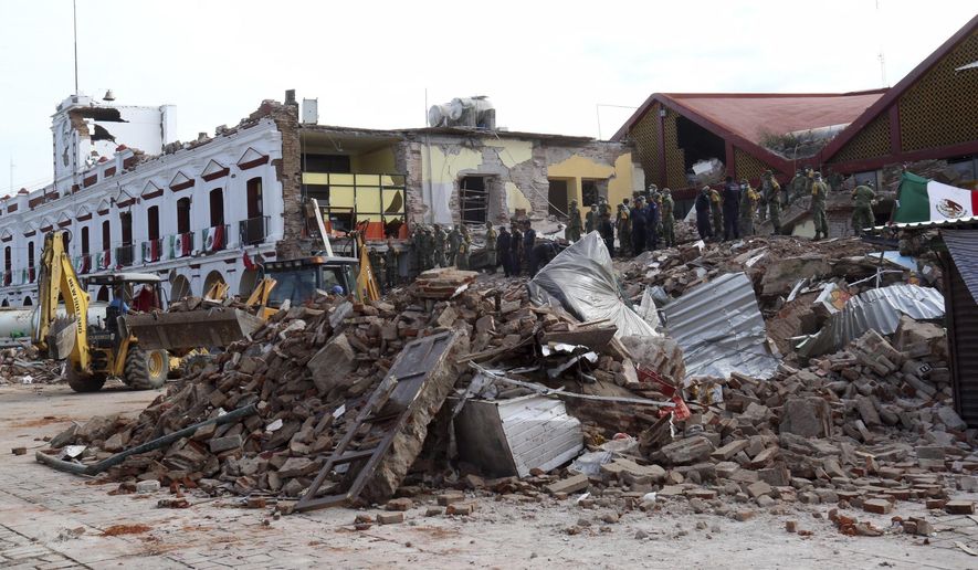 Soldiers remove debris from a partly collapsed municipal building after an earthquake in Juchitan, Oaxaca state, Mexico, Friday, Sept. 8, 2017. One of the most powerful earthquakes ever to strike Mexico has hit off its southern Pacific coast, killing at least 32 people, toppling houses, government offices and businesses. With multiple intense hurricanes, a powerful earthquake, wildfires and deadly flooding from Houston to India it seems that nature recently has just gone nuts. Some of these disasters, like Friday’s earthquake in Mexico, are natural. Others may end up having a mix of natural and man-made ingredients after scientists examine them. Experts in risk and psychology said we look for patterns in overwhelming things like disasters. Sometimes there’s a pattern in chaos. Sometimes there isn’t. (AP Photo/Luis Alberto Cruz)
