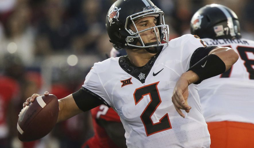 Oklahoma State quarterback Mason Rudolph looks to throw against South Alabama during the first half of an NCAA college football game, Friday, Sept. 8, 2017, in Mobile, Ala. (AP Photo/Dan Anderson)