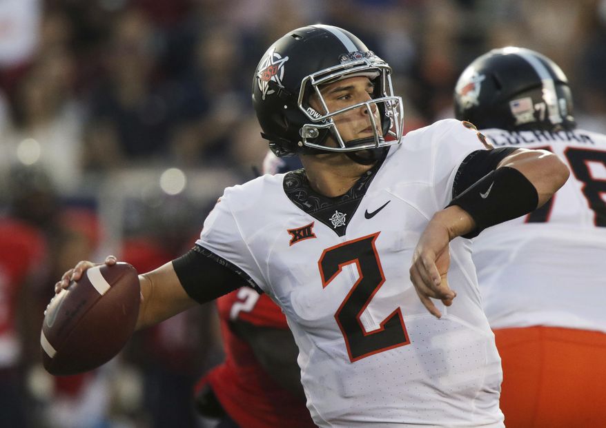 Oklahoma State quarterback Mason Rudolph looks to throw against South Alabama during the first half of an NCAA college football game, Friday, Sept. 8, 2017, in Mobile, Ala. (AP Photo/Dan Anderson)