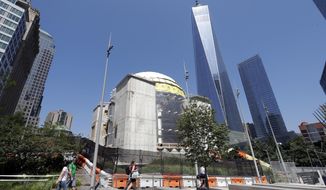 In this Aug. 10, 2017 photo, the St. Nicholas National Shrine, center, designed by renowned architect Santiago Calatrava, is under construction at the World Trade Center in New York. It is replacing a tiny Greek Orthodox church that was crushed by the Trade Center&#39;s south tower during the terrorist attacks of Sept. 11, 2001. (AP Photo/Mark Lennihan)
