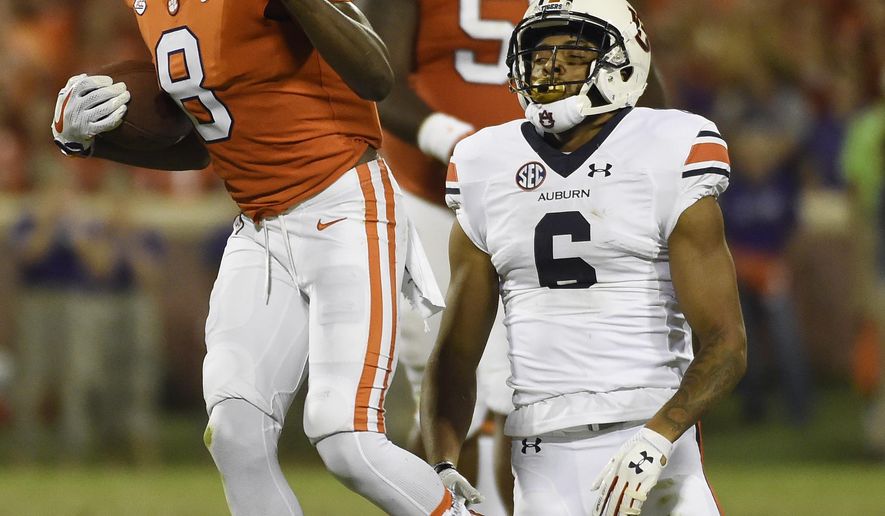 Clemson wide receiver Deon Cain (8) gestures after a catch as Auburn defensive back Carlton Davis (6) reacts during the second half of an NCAA college football game, Saturday, Sept. 9, 2017, in Clemson, S.C. (AP Photo/Rainier Ehrhardt)