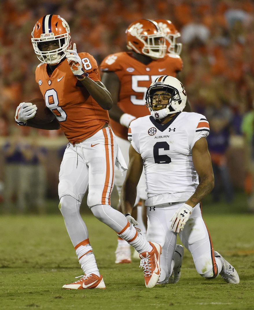 Clemson wide receiver Deon Cain (8) gestures after a catch as Auburn defensive back Carlton Davis (6) reacts during the second half of an NCAA college football game, Saturday, Sept. 9, 2017, in Clemson, S.C. (AP Photo/Rainier Ehrhardt)