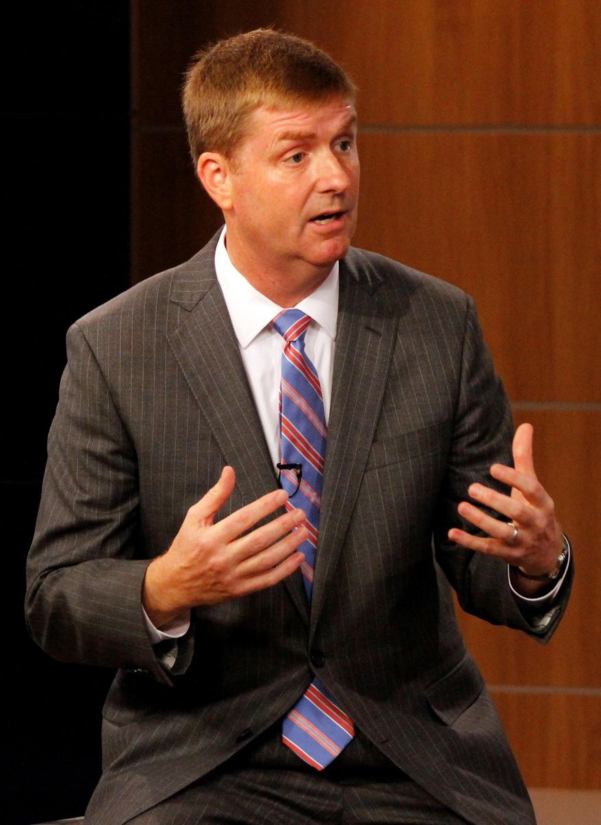 City Councilman Kenny Smith speaks to the moderator during a Mayoral debate in Charlotte, N.C. on Wednesday, Sept. 6, 2017. Smith is a Republican candidate running for mayor. The city's primary is scheduled for Tuesday, Sept. 12. (AP Photo/Skip Foreman)