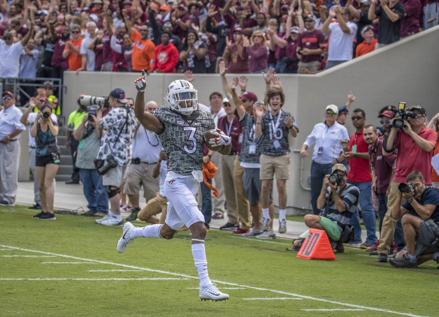 Virginia Tech's Greg Stroman (3) celebrates for a touchdown on a punt return against Delaware during the first half of an NCAA college football game, Saturday, Sept. 9, 2017, at Lane Stadium in Blacksburg, Va. (AP Photo/Don Petersen)