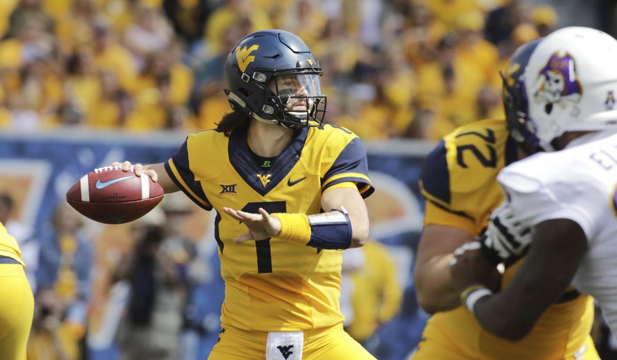 West Virginia quarterback Will Grier (7) attempts a pass during the first half of an NCAA college football game against East Carolina, Saturday, Sept. 9, 2017, in Morgantown, W.Va. (AP Photo/Raymond Thompson)