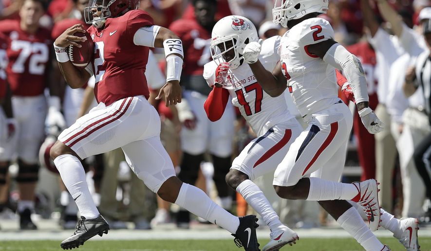 Alabama quarterback Jalen Hurts runs in for a touchdown in the first half of an NCAA college football game against Fresno State, Saturday, Sept. 9, 2017, in Tuscaloosa, Ala. (AP Photo/Brynn Anderson)