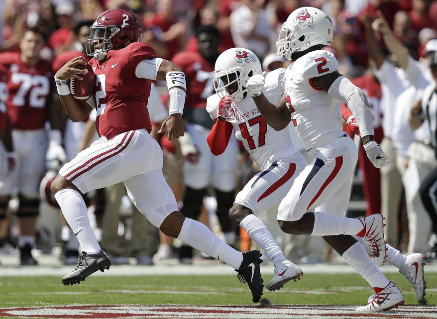 Alabama quarterback Jalen Hurts runs in for a touchdown in the first half of an NCAA college football game against Fresno State, Saturday, Sept. 9, 2017, in Tuscaloosa, Ala. (AP Photo/Brynn Anderson)
