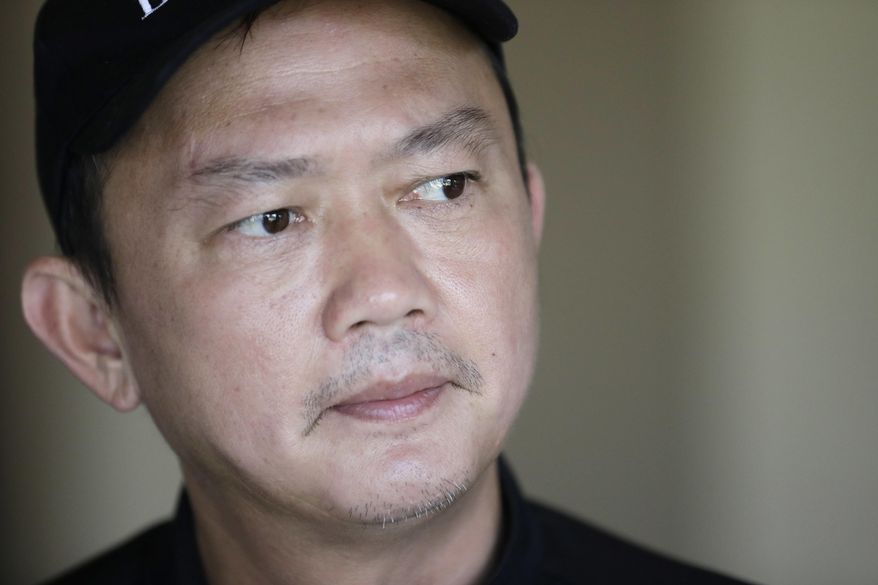 Viet Dao talks about his experiences during Hurricane Harvey in his home in Spring, Texas, on Wednesday, Sept. 6, 2017. “It hits you right there: We have nowhere to escape,” Dao, 48, says. “If it was just me, it’s OK, I can survive. But I just don’t know how can I help my children and family get out. It’s really frustrating.” (AP Photo/David J. Phillip)