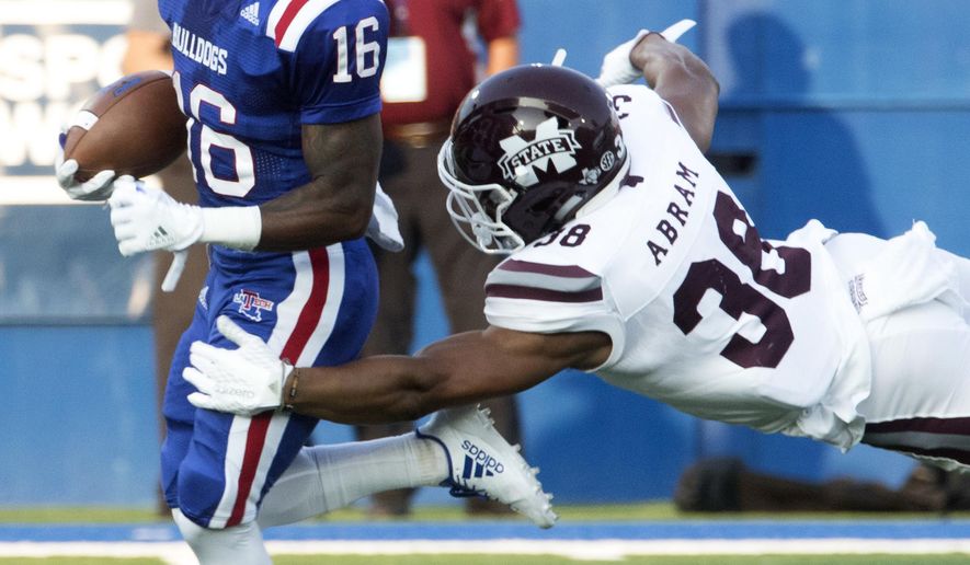 Louisiana Tech wide receiver Marcus Gaines attempts to get away from Mississippi State defensive back Jonathan Abram during an NCAA college football game in Ruston, La., Saturday, Sept. 9, 2017. (Hannah Baldwin/Monroe News Star via AP)