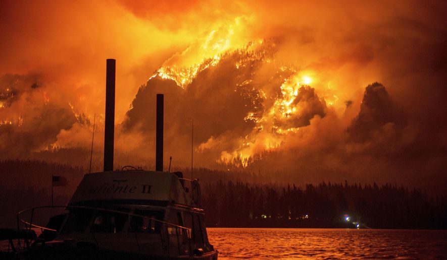 This photo provided by KATU-TV shows the Eagle Creek wildfire as seen from Stevenson Wash., across the Columbia River, burning in the Columbia River Gorge above Cascade Locks, Ore., on Monday Sept. 4, 2017. Wildfire smoke is especially dangerous to people with chronic heart and lung problems, said Julie Fox, an environmental epidemiologist with the Washington State Department of Health. The smoke is a combination of several toxins, and its tiny particles can be inhaled deeply into the lungs, she said. (Tristan Fortsch/KATU-TV via AP)