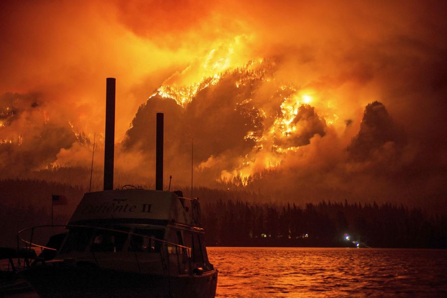This photo provided by KATU-TV shows the Eagle Creek wildfire as seen from Stevenson Wash., across the Columbia River, burning in the Columbia River Gorge above Cascade Locks, Ore., on Monday Sept. 4, 2017. Wildfire smoke is especially dangerous to people with chronic heart and lung problems, said Julie Fox, an environmental epidemiologist with the Washington State Department of Health. The smoke is a combination of several toxins, and its tiny particles can be inhaled deeply into the lungs, she said. (Tristan Fortsch/KATU-TV via AP)