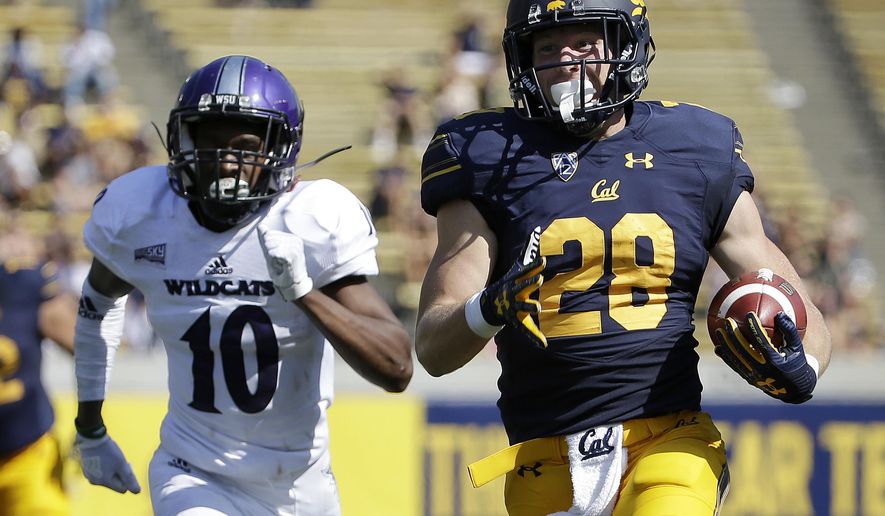California running back Patrick Laird (28) runs past Weber State cornerback Keilan Benjamin (10) to score a touchdown during the first half of an NCAA college football game in Berkeley, Calif., Saturday, Sept. 9, 2017. (AP Photo/Jeff Chiu)