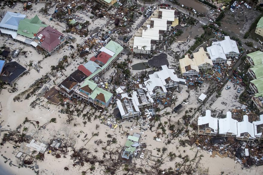 This Sept. 6, 2017 photo provided by the Dutch Defense Ministry shows storm damage in the aftermath of Hurricane Irma, in St. Maarten. Irma cut a path of devastation across the northern Caribbean, leaving thousands homeless after destroying buildings and uprooting trees. Significant damage was reported on the island that is split between French and Dutch control. (Gerben Van Es/Dutch Defense Ministry via AP)