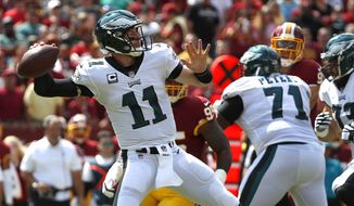 Philadelphia Eagles quarterback Carson Wentz (11) throws to a receiver in the first half of an NFL football game against the Washington Redskins, Sunday, Sept. 10, 2017, in Landover, Md. (AP Photo/Alex Brandon)