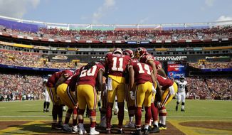 Washington Redskins wide receiver Terrelle Pryor (11) huddles with teammates in the second half of an NFL football game against the Philadelphia Eagles, Sunday, Sept. 10, 2017, in Landover, Md. (AP Photo/Mark Tenally)