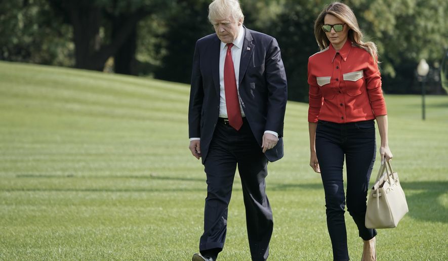 President Donald Trump and first lady Melania Trump walk across the South Lawn of the White House in Washington during their arrival on Marine One helicopter, Sunday, Sept. 10, 2017. Trump his family and staff where returning from presidential retreat at Camp David, Md. (AP Photo/Pablo Martinez Monsivais)