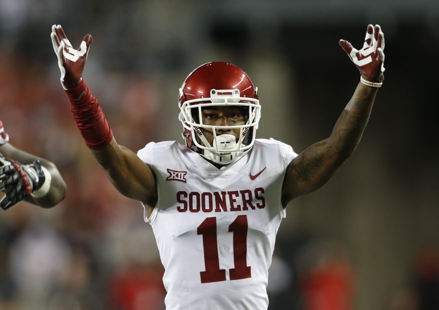 Oklahoma cornerback Parnell Motley celebrates his interception against Ohio State during the second half of an NCAA college football game Saturday, Sept. 9, 2017, in Columbus, Ohio. Oklahoma defeated Ohio State 31-16. (AP Photo/Paul Vernon)