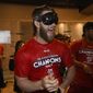 Washington Nationals&#39; Bryce Harper reacts in the locker room as the team celebrates after they clinched the National League East title after a baseball game against the Philadelphia Phillies, Sunday, Sept. 10, 2017, in Washington.(AP Photo/Nick Wass)