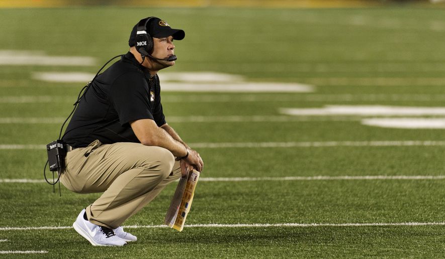 Missouri head coach Barry Odom drops to his knees after South Carolina scored during the fourth quarter of an NCAA college football game Saturday, Sept. 9, 2017, in Columbia, Mo. South Carolina won the game 31-13. (AP Photo/L.G. Patterson)