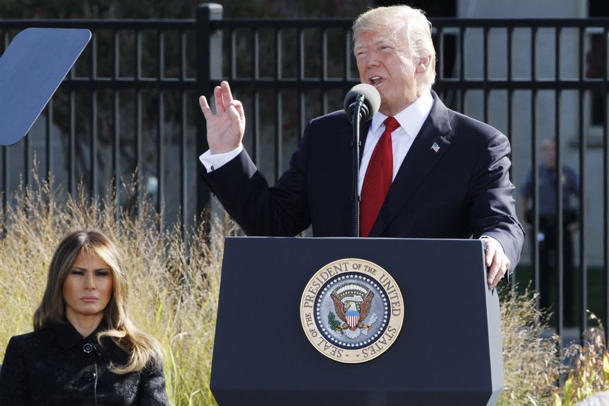 President Trump, accompanied by first lady Melania Trump, spoke at the Pentagon Memorial on Monday, the 16th anniversary of the Sept. 11 attacks. (Associated Press)