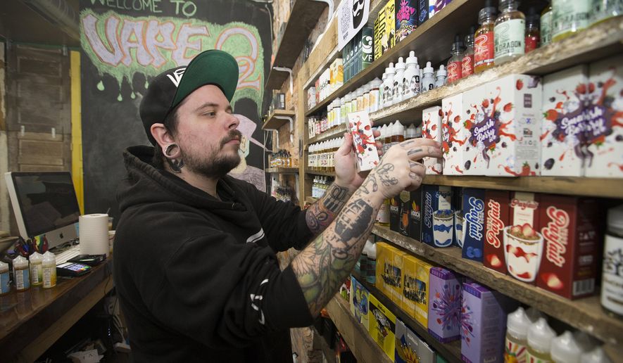 Myk Londino, manager of Vape O2, in Philadelphia, talks about how the vape tax has affected local businesses. (Charles Fox/The Philadelphia Inquirer via AP)