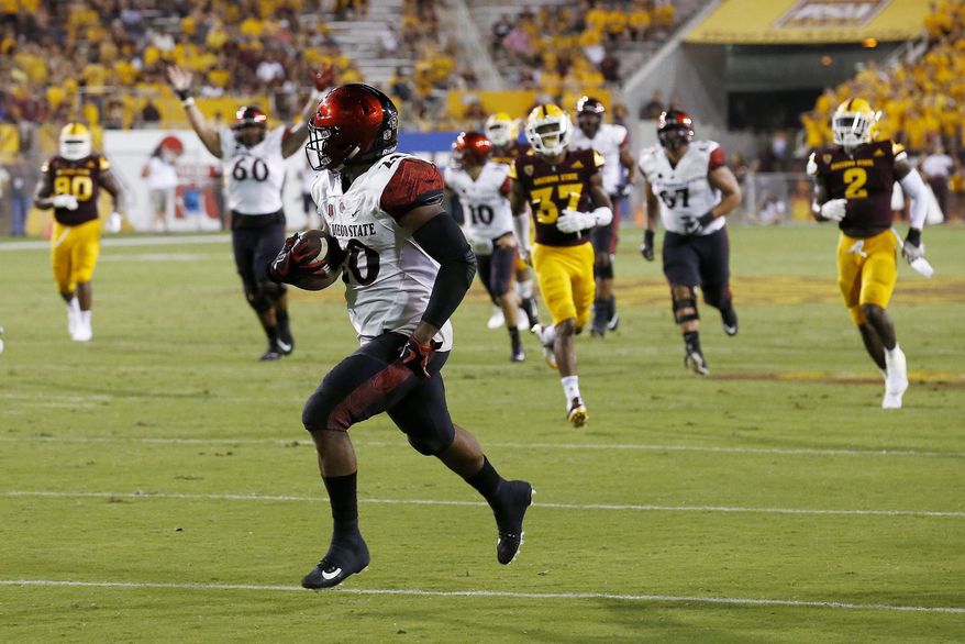 San Diego State's Rashaad Penny runs for a touchdown against Arizona State during the second half of an NCAA college football game Saturday, Sept. 9, 2017, in Tempe, Ariz. San Diego State defeated Arizona State 30-20. (AP Photo/Ross D. Franklin)