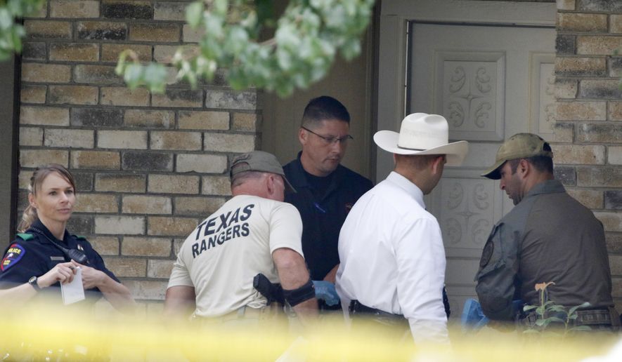 Plano police and the Texas Rangers work the scene of a shooting at a home in the 1700 block of West Spring Creek Parkway in Plano, Texas, Monday, Sept. 11, 2017. Multiple people were fatally shot to death, and their attacker was killed by a police officer Sunday night, authorities said. (David Woo/The Dallas Morning News via AP)