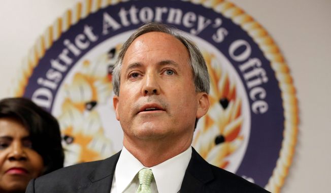 Texas Attorney General Ken Paxton speaks at a news conference in Dallas on June 22, 2017. (Associated Press) ** FILE **