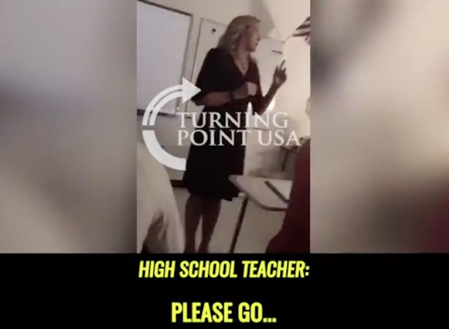 A teacher at River Ridge High School in Woodstock, Georgia, has been pulled from the classroom after a video showing her comparing President Trump's campaign slogan "Make America Great Again" to a swastika went viral.
(Facebook/@Turning Point News)