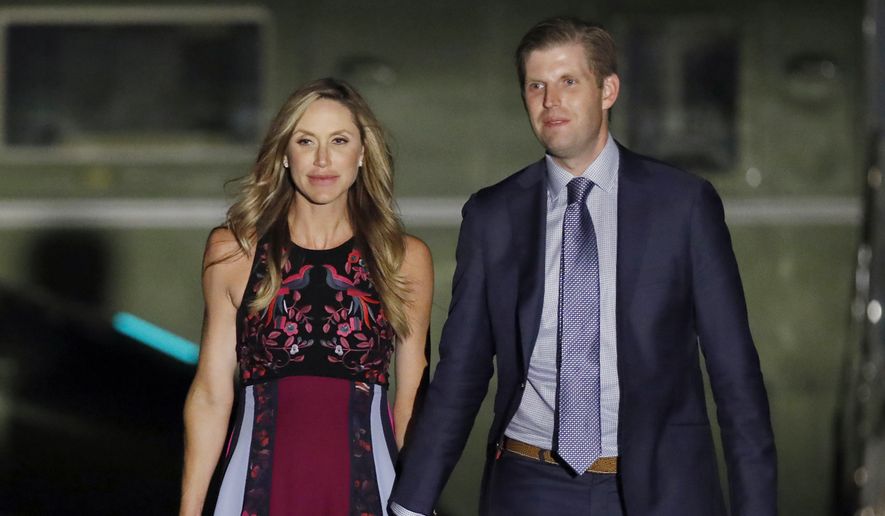 In this Aug, 3, 2017, file photo, Eric Trump, right, and his wife Lara Trump, walk away from Marine One on the South Lawn of the White House in Washington. (AP Photo/Alex Brandon) ** FILE **